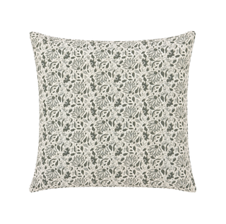 Decorative pillow with a leaf pattern on a white background